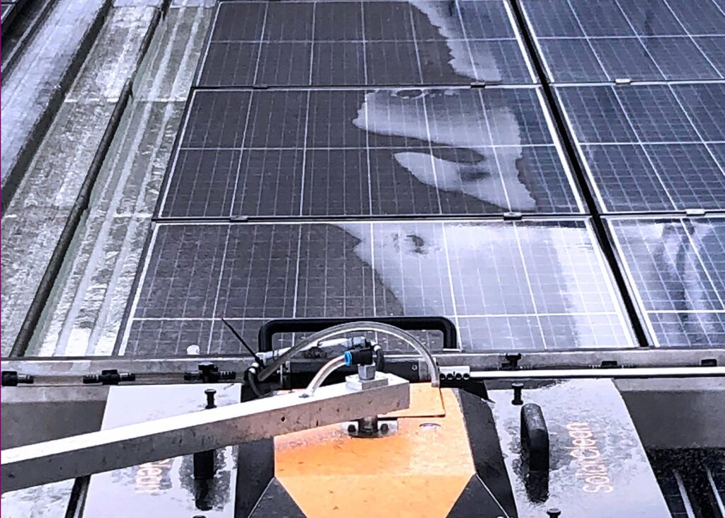 solar panels shining after being cleaned safely and without scratches by a mechanized robot